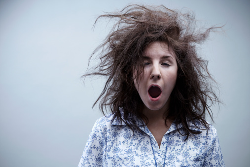 Young woman yawning, close up