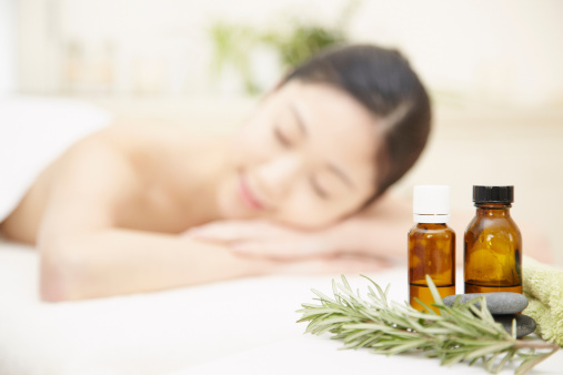 Aromatherapy oils with woman in background